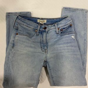 Light wash madewell mid rise classic straight leg distressed jeans.